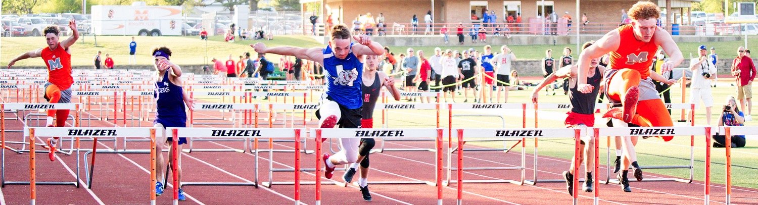 TJ Moreland, Ford Tannebaum and Dawson Pendergrass run the 110 meter hurdles. Tannebaum finished 2nd in 16.44 seconds and Pendergrass edged him out for gold by .22 seconds. In the 300 meter hurdles, Moreland was 2nd and Tannebaum 3rd. [run, don't walk, for more shots]